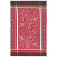 Red towel with white floral and bird pattern on a white background