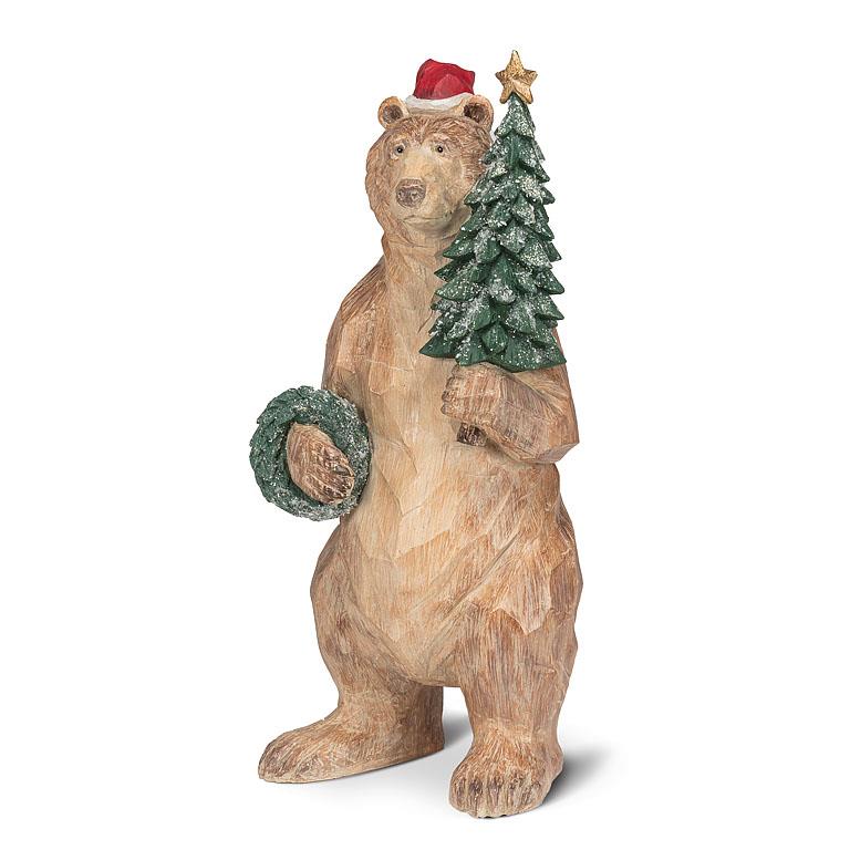 Wood look bear figurine with Christmas decorations on a white background