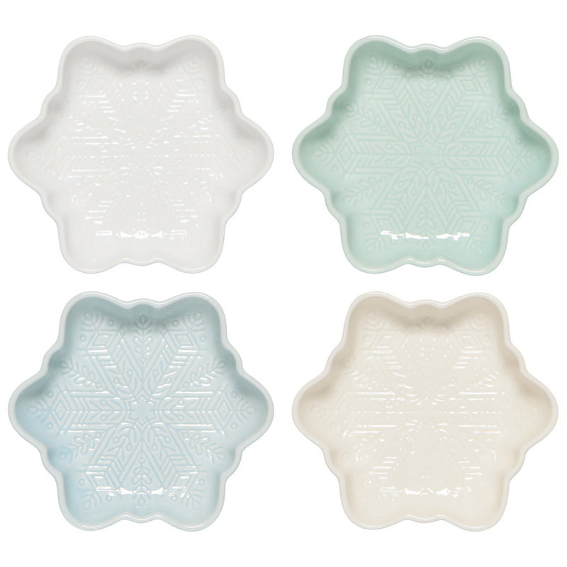 Four star-shaped ceramic dishes in white, light blue, and beige on a white background